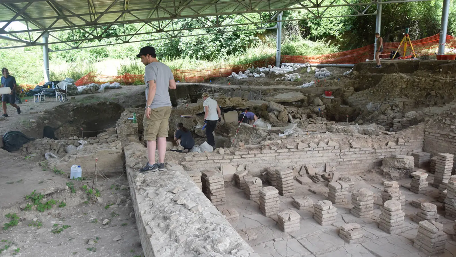 Archaeologists excavating the Roman bath complex at Carsulae in Italy
