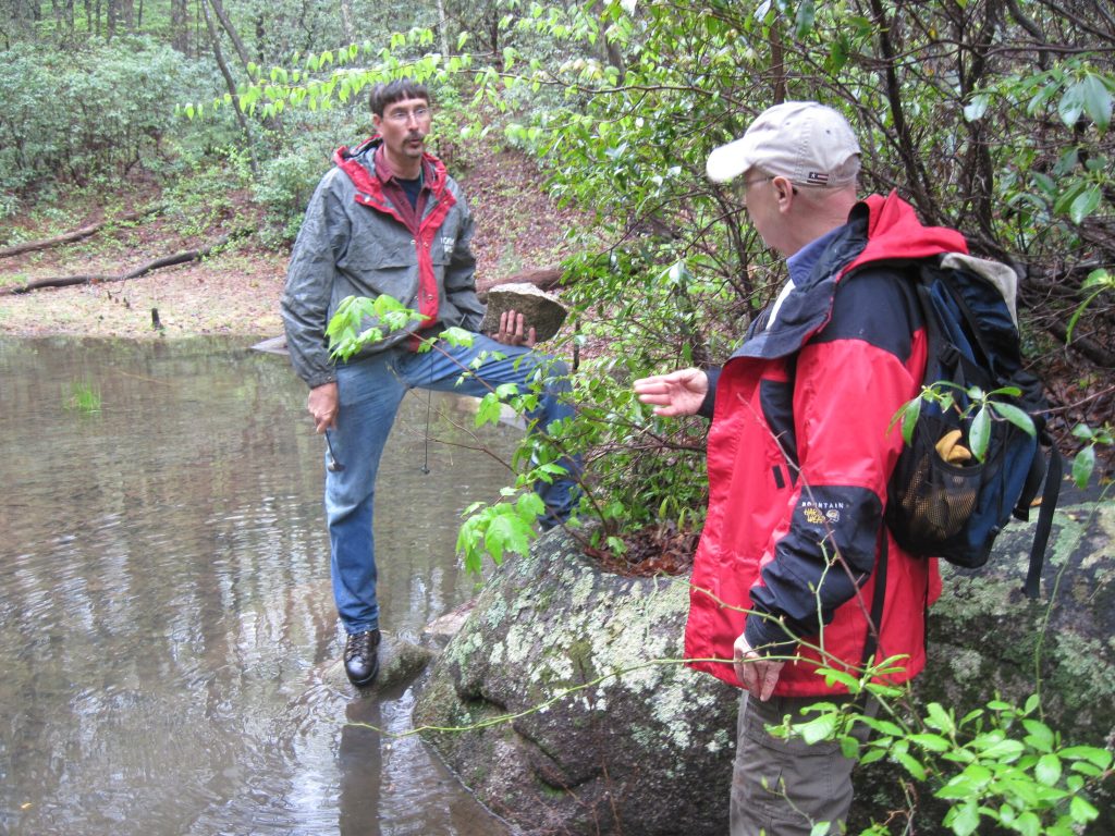 Two USGS scientists discussing field sampling methods