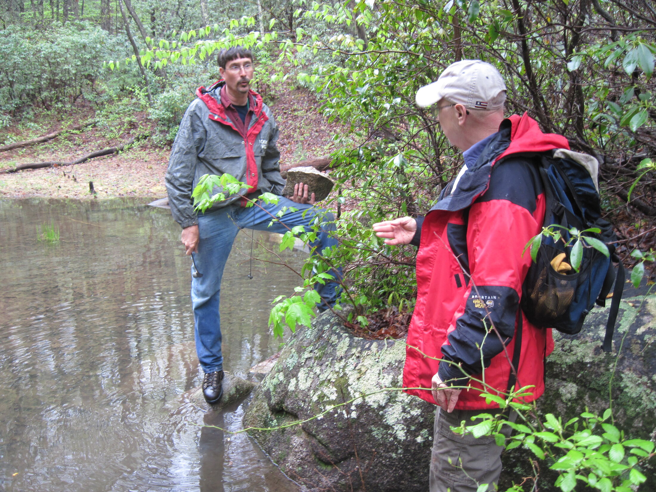 Two USGS scientists discussing field sampling methods