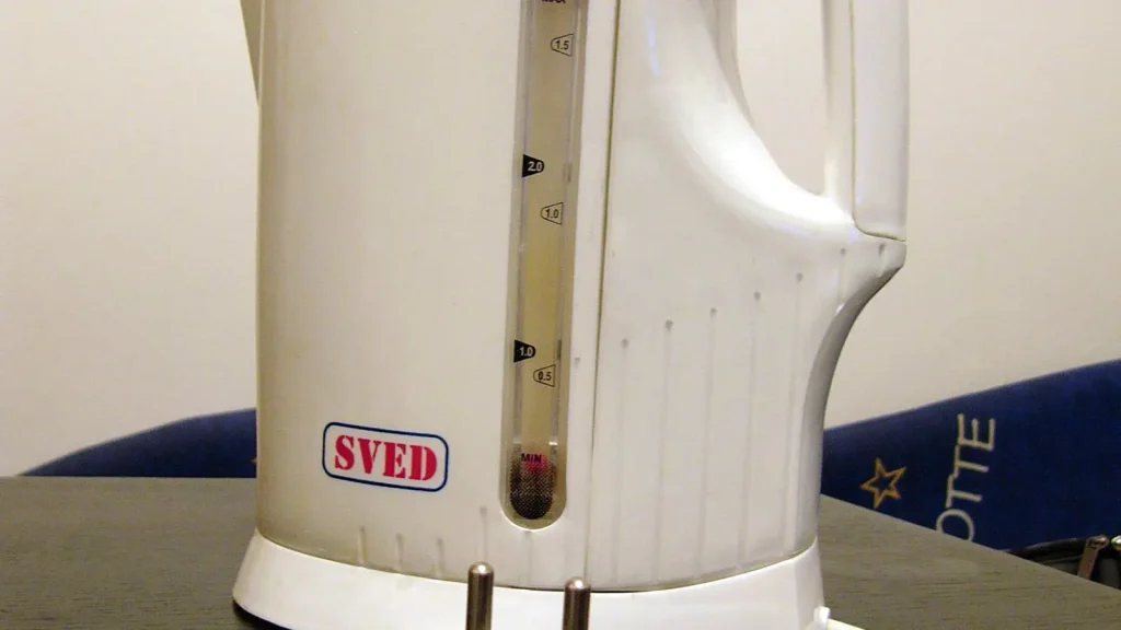 White electric kettle photographed on a kitchen surface