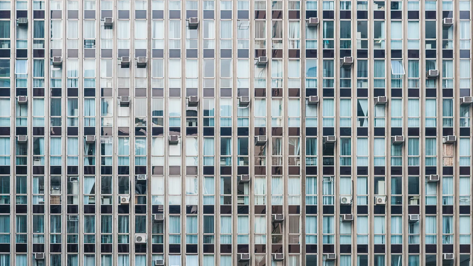 Modern building with a large transparent and reflective glass facade