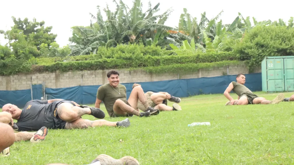 Athlete stretching on the floor after a workout