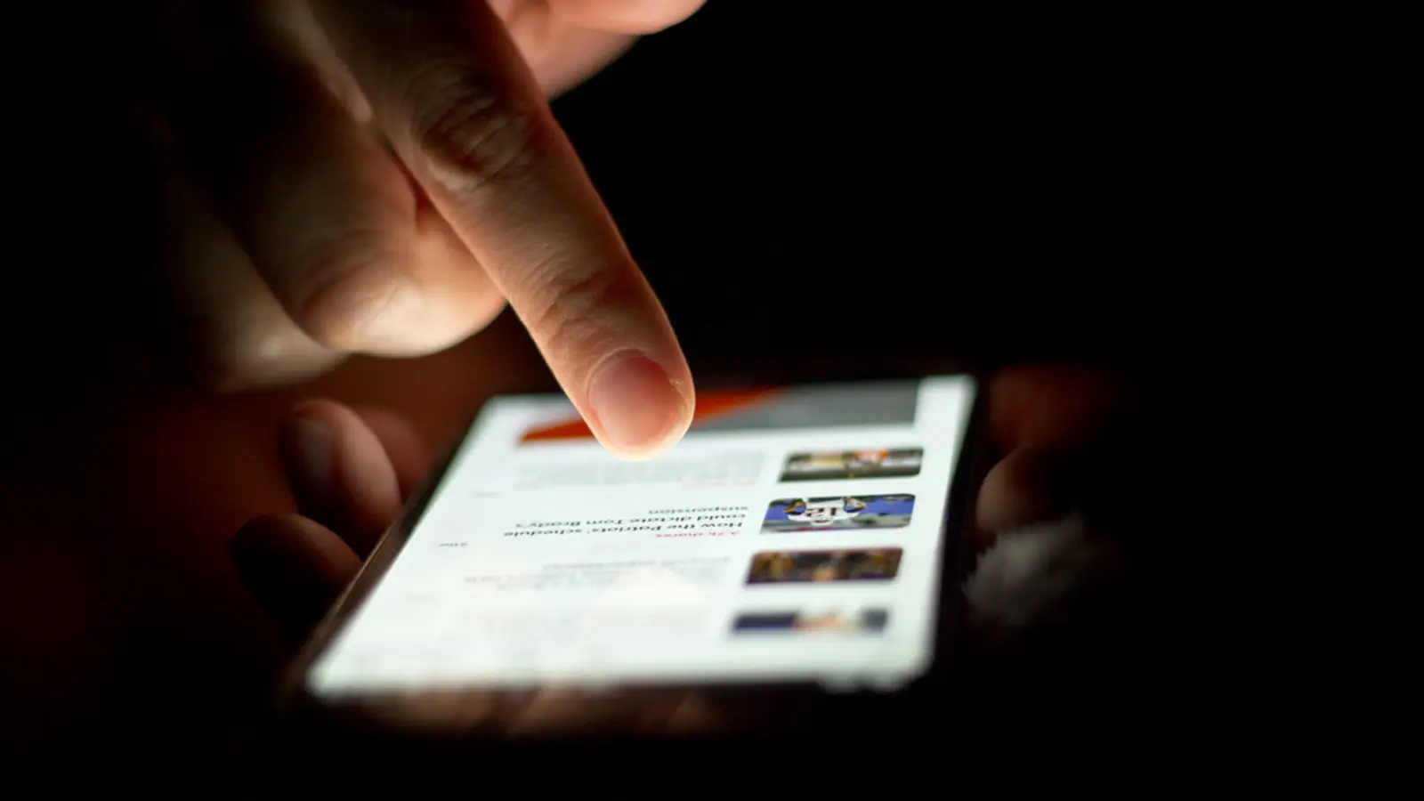 Person scrolling on a smartphone touchscreen with one finger