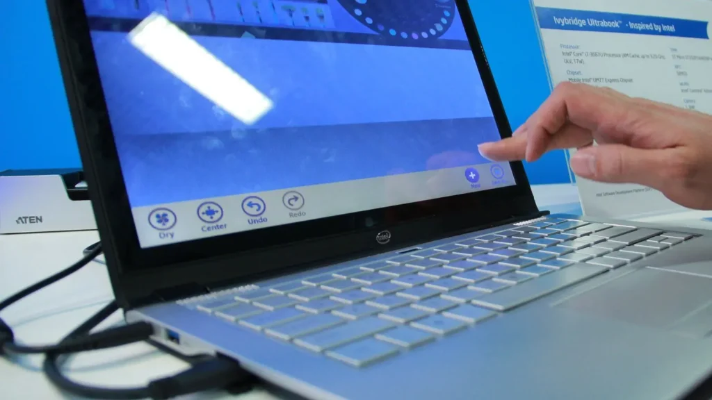 Person using a finger to interact with a large touchscreen display